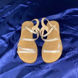 Tan sandals with gem laces silver buckle and they were used once